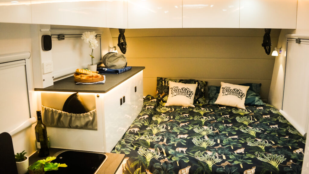 Hybrid caravan bedroom with ambient lighting
