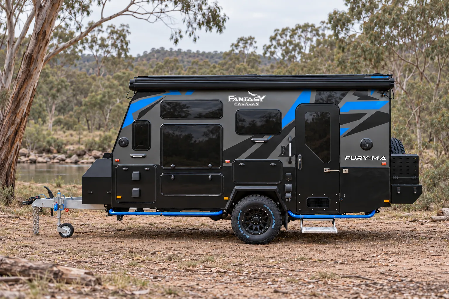 Fury 48V hard top hybrid caravan at camp by a river
