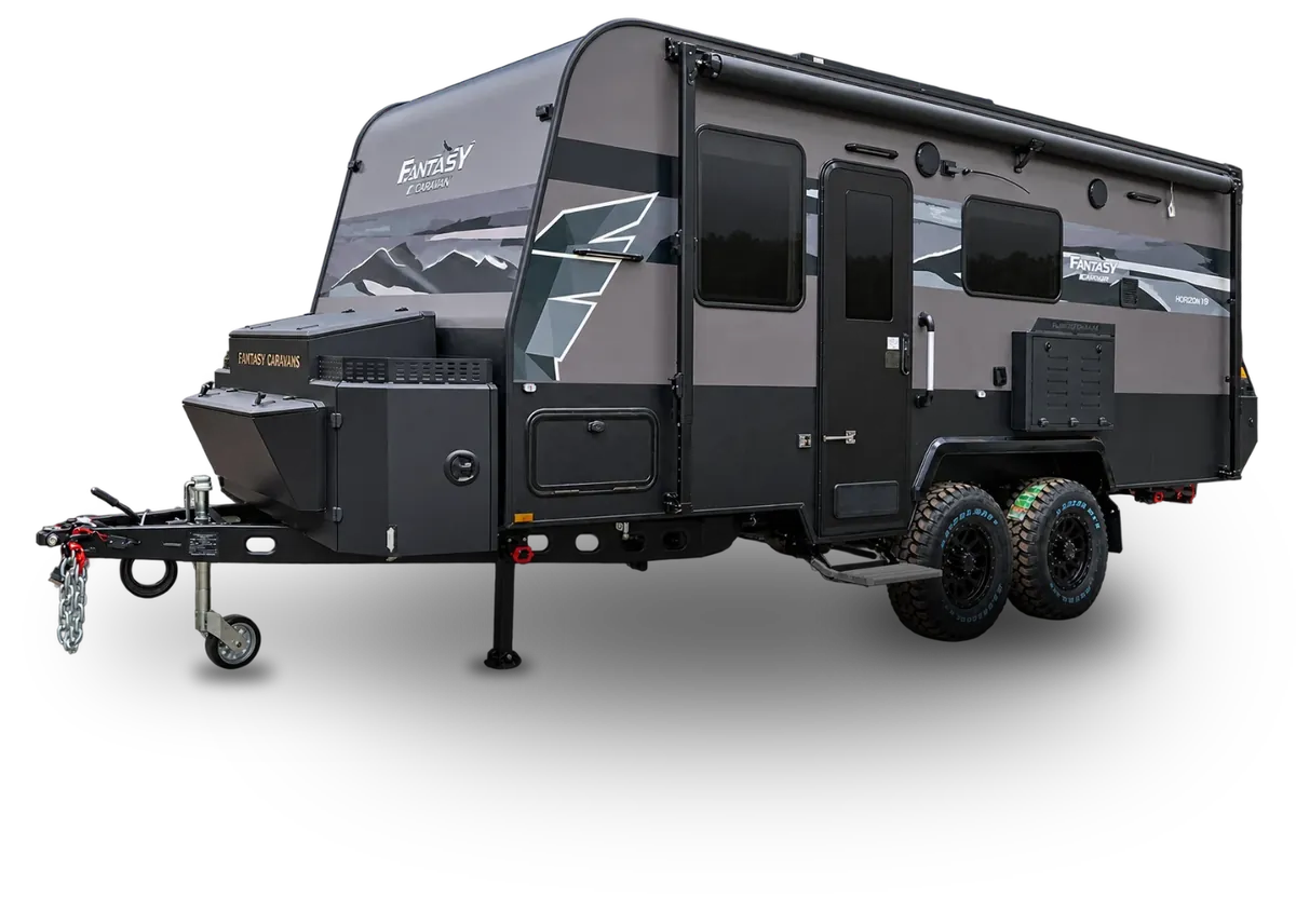 Fantasy Caravan Horizon 19 multi-terrain caravan, front three-quarter view showing the drawbar, front toolbox and mud-terrain tyres