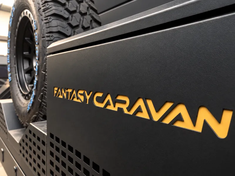 Horizon matte black exterior panel with gold FANTASY CARAVAN lettering