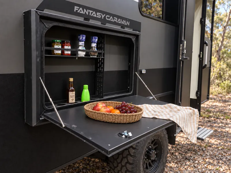 Horizon fold-down picnic table with bottle storage and casual snacks