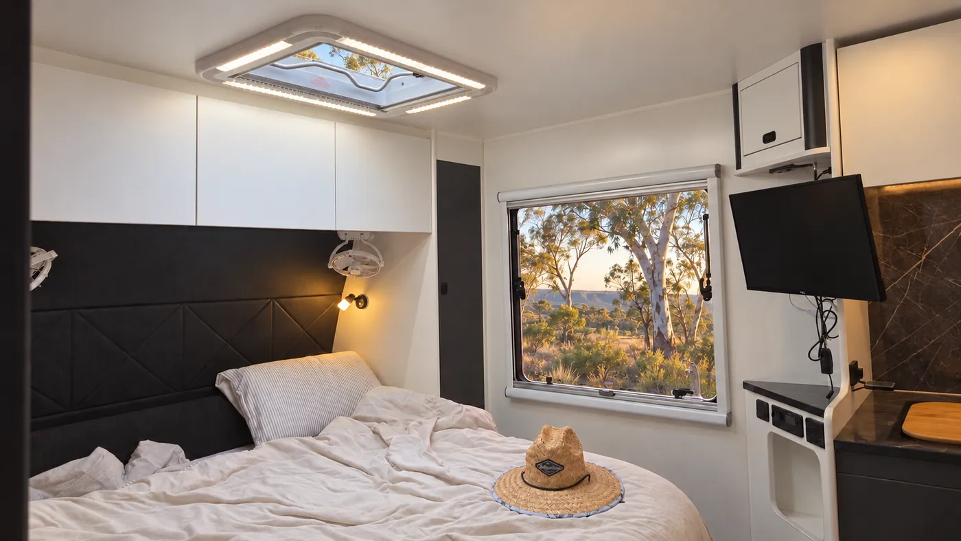 Horizon bedroom skylight with integrated perimeter lighting and a bush view through the window