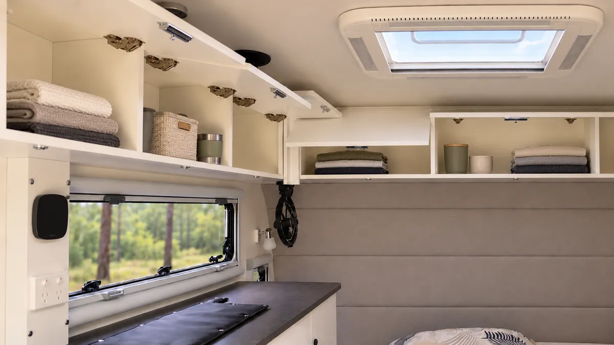 Overhead cabinets and roof hatch inside a Fury 48V hard top