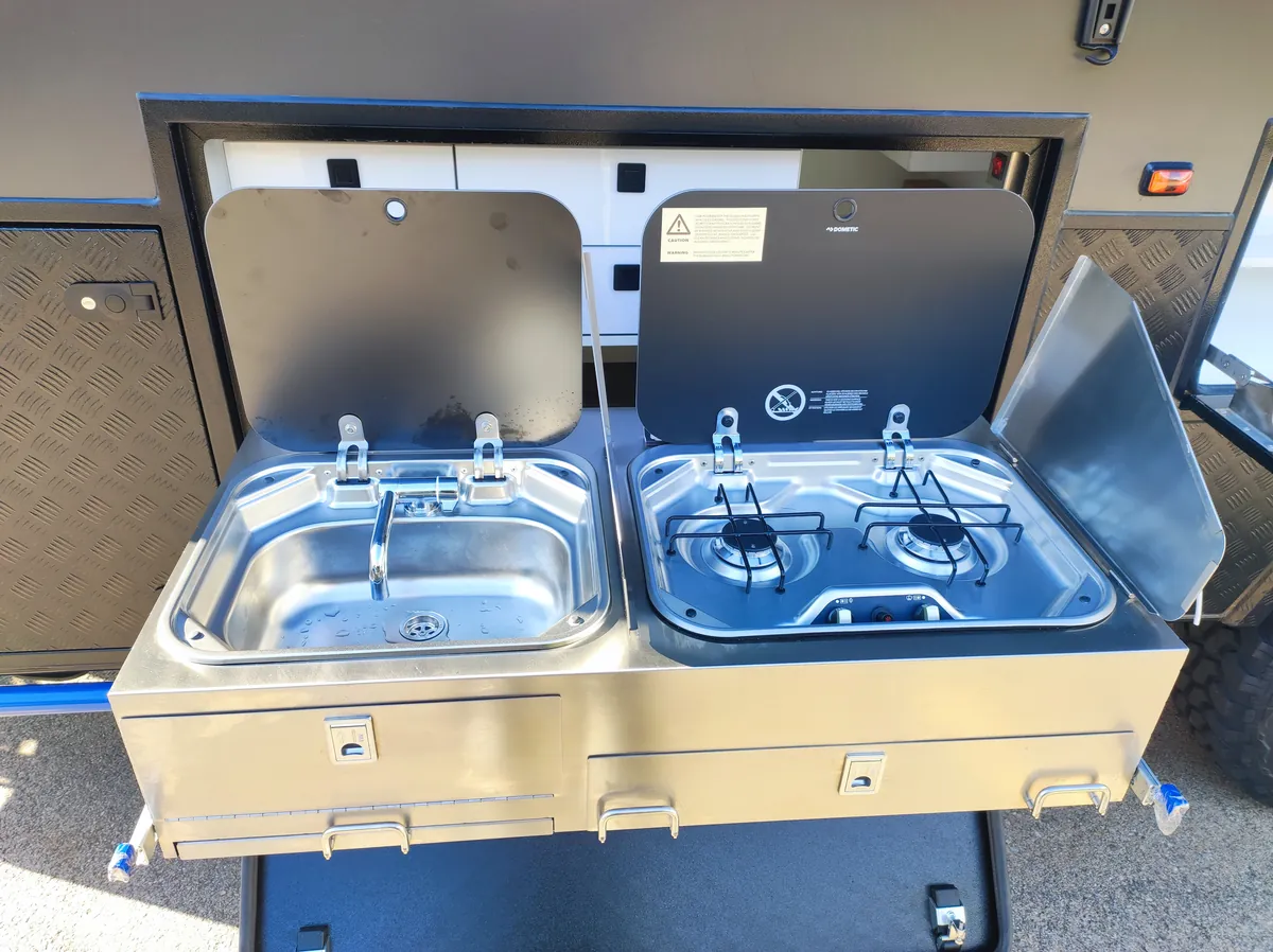 Slide-out kitchen and storage on a Fury 48V hard top